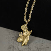 10k gold satin Pillsbury Doughboy pendant holding a money bag on a gold rope chain.