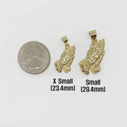 Two sizes of 10k solid gold praying hands pendants displayed alongside a US quarter.