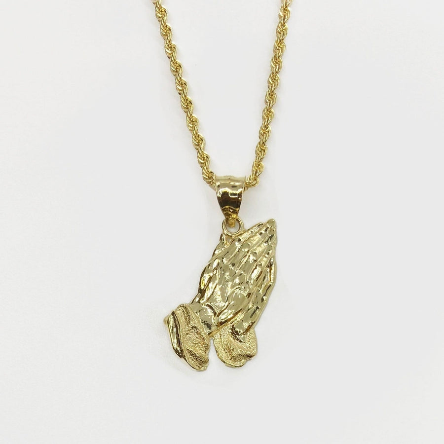 10k solid yellow gold praying hands pendant displayed on a matching gold rope chain.