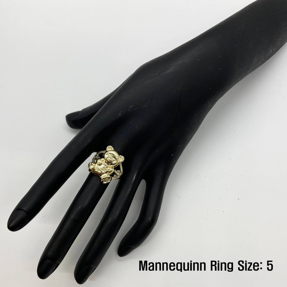 10k Gold Teddy Bear ring on a black mannequin hand.