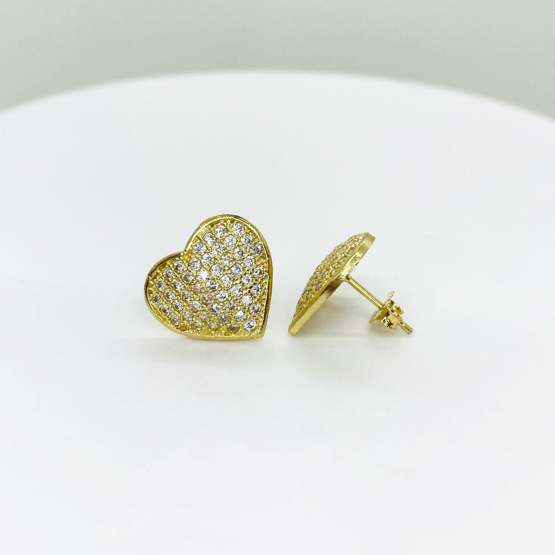 Pair of 10k gold heart-shaped stud earrings featuring pavé-set clear cubic zirconia stones.