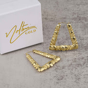 Pair of 10k gold twisted heart square hoop earrings next to a Nolters Gold box.