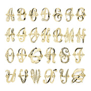 Grid display of 10k yellow gold large cursive initial rings showing multiple alphabet letters.