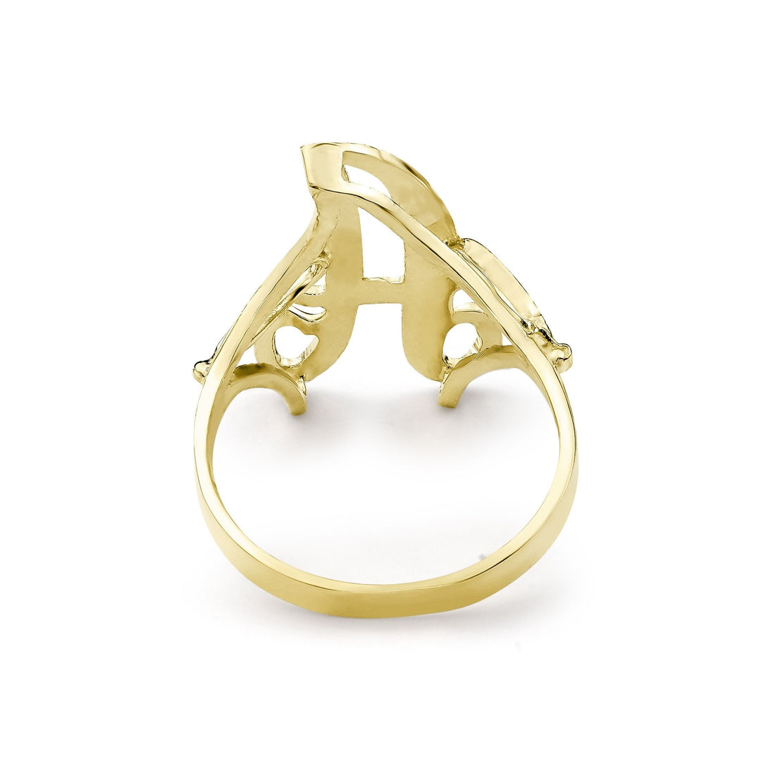 Back angle of a medium gold cursive signet ring on white background.