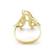 Back angle of a medium gold cursive signet ring on white background.