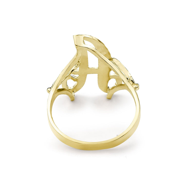Back angle of a medium gold cursive signet ring on white background.