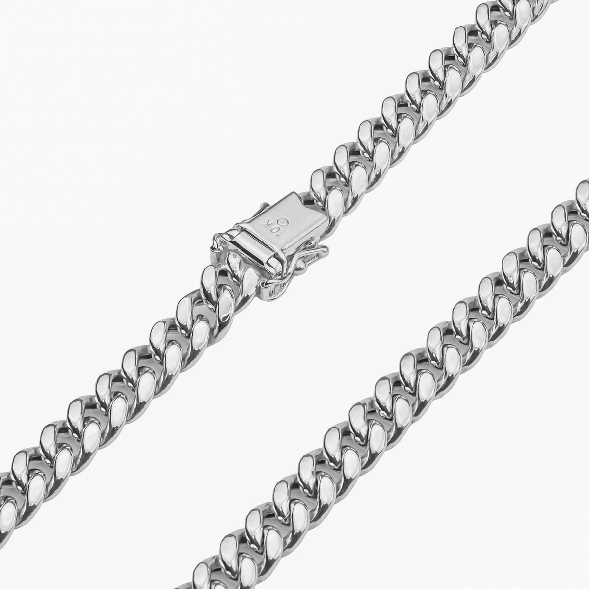 Close-up view of a 10k white gold semi-solid Miami Cuban chain highlighting the box lock clasp.