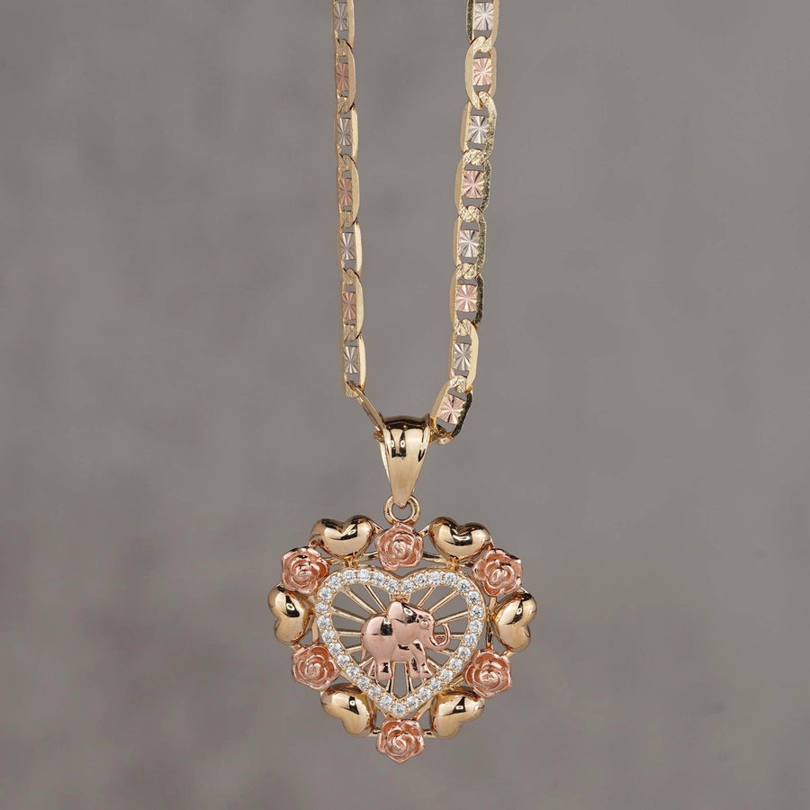 14k gold and rose gold heart pendant with elephant motif and floral border.