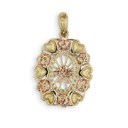 Reverse view of tricolor gold oval pendant showing flat polished metal.
