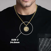 Man wearing a 34.0mm Size 2 gold Centenario pendant necklace over a black shirt.