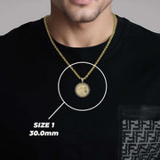 Man wearing a 30.0mm 14k gold Centenario CZ pendant necklace over a black shirt.