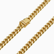 Detailed view of 14k gold Miami Cuban chain showing double safety box lock clasp.