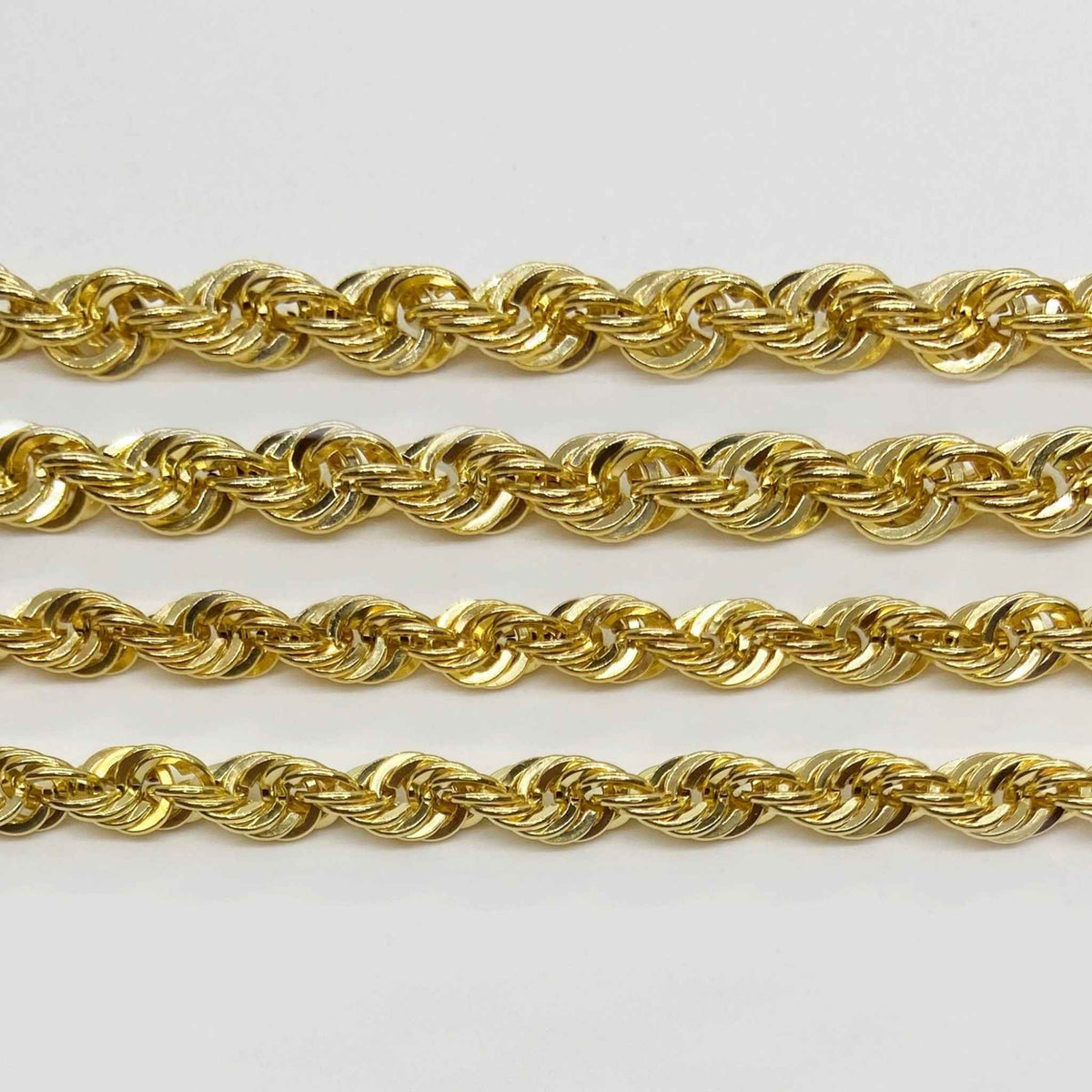 Four different thicknesses of 14k gold classic rope chains displayed horizontally.