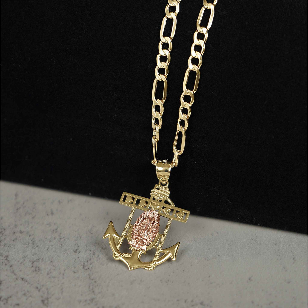 Close-up photo of the 14k Gold Divine Two-Tone Guadalupe Anchor Pendant hanging on a matching chain.