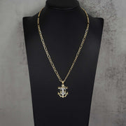 14k two-tone gold crucifix anchor pendant necklace displayed on a black mannequin bust.