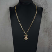 14k gold Lady Guadalupe anchor pendant necklace featured on a black jewelry mannequin display