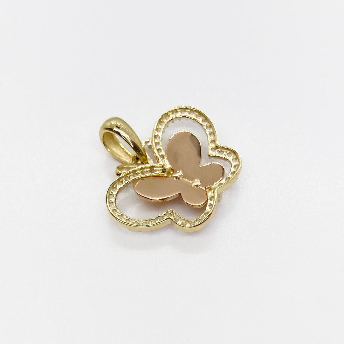 Back view of 14k gold tri-color butterfly pendant charm with CZ halo.