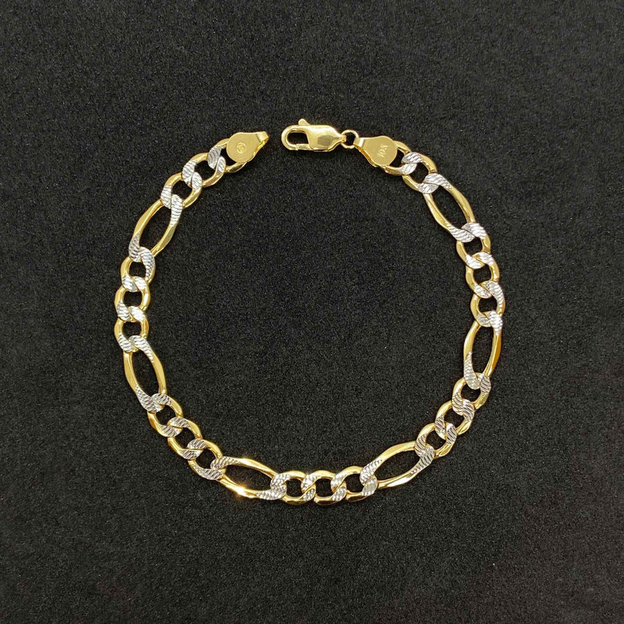 A 14k gold Figaro pave diamond-cut link chain bracelet with a lobster claw clasp.