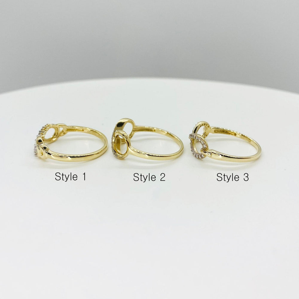 Three 14k gold rings with infinity design side view labeled Style 1, Style 2, and Style 3 
