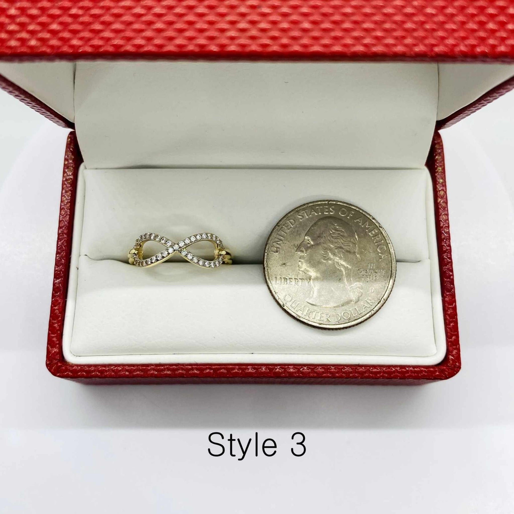 14k infinity Gold ring and silver coin in a red jewelry box with Style 3 text.