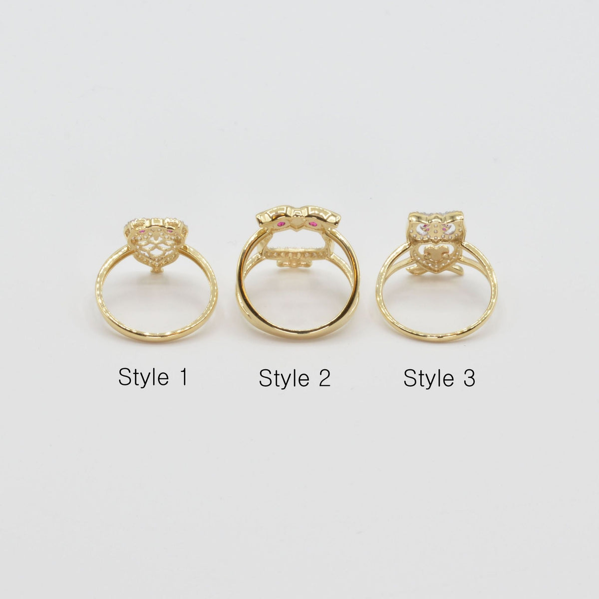 Three 14k gold owl rings back view labeled Style 1, Style 2, and Style 3 