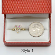 14k Gold owl ring with pink Cubic Zirconia in a red jewelry box with a coin for scale.