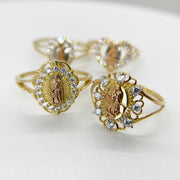 two 14k Gold rings with religious design on a white background