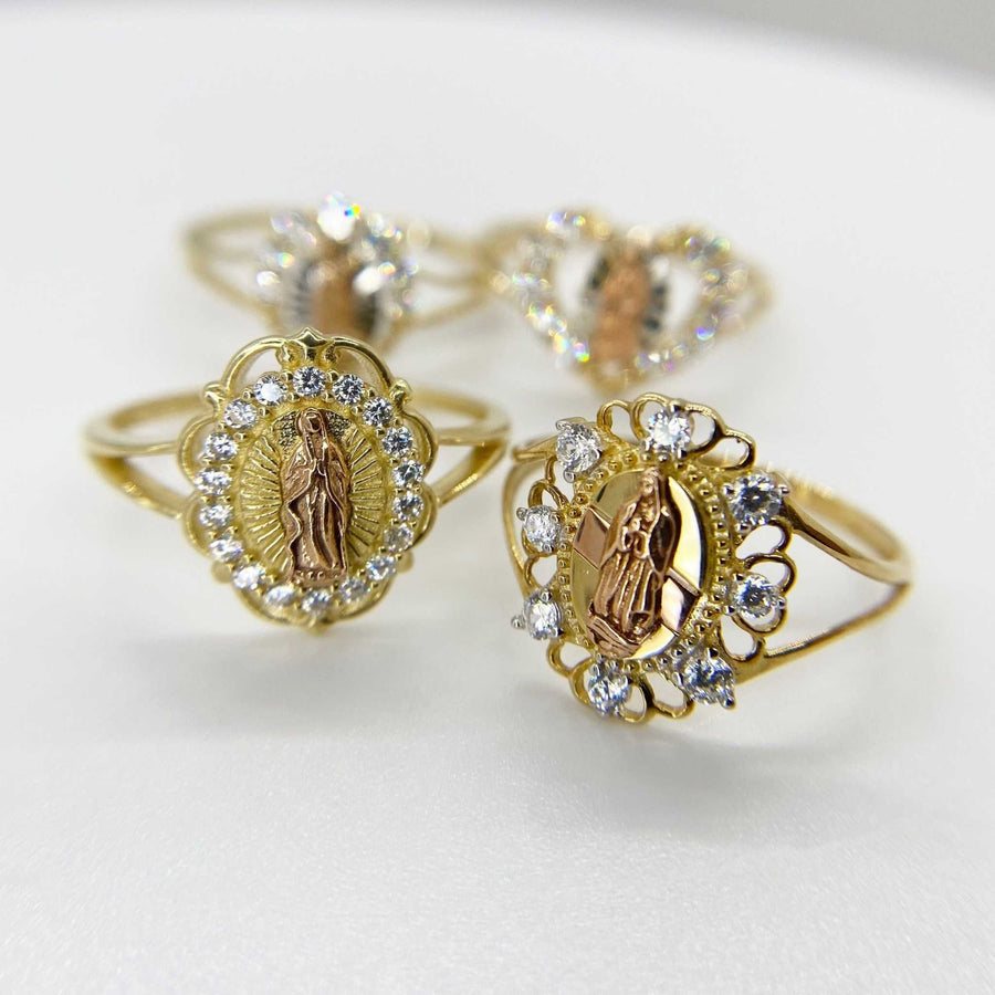two 14k Gold rings with religious design on a white background
