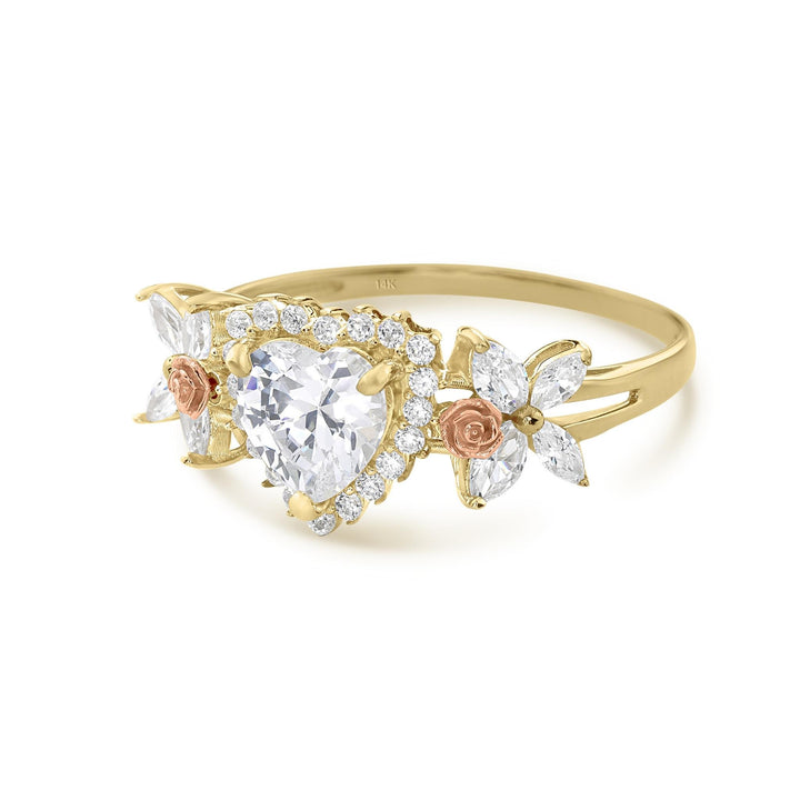 14k gold birthstone ring with a halo-set heart cz and rose gold flower details.