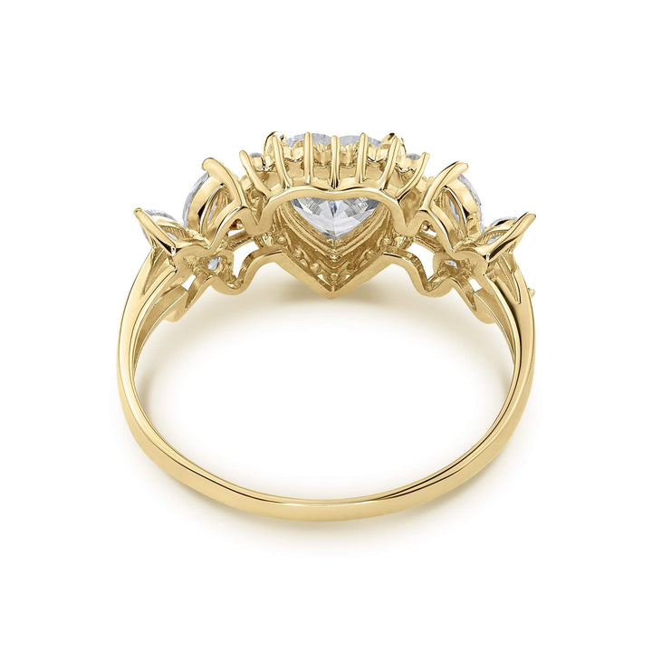 Back view of 14k gold birthstone ring showing the hollow heart crown setting underbelly.
