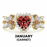 14k gold heart ring with red garnet birthstone and January text label.