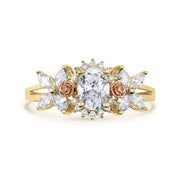 14k gold birthstone ring with a halo-set oval cz and rose gold flower details