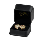 Tricolor 14k gold elephant heart stud earrings displayed inside a black Nolters jewelry box.