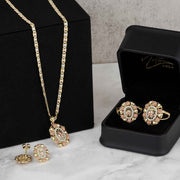 Tricolor gold jewelry set with elephant oval pendant necklace, matching earrings, and ring