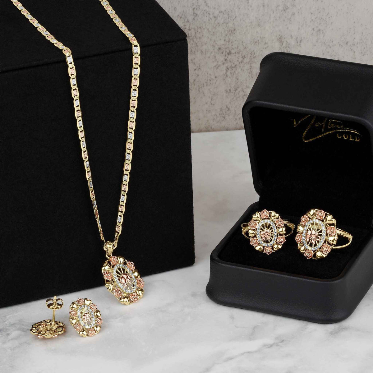 Tricolor gold jewelry set with elephant oval pendant necklace, matching earrings, and ring