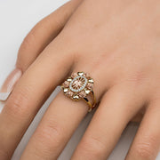 Model’s hand wearing a tricolor 14k gold elephant oval ring with CZ accents.