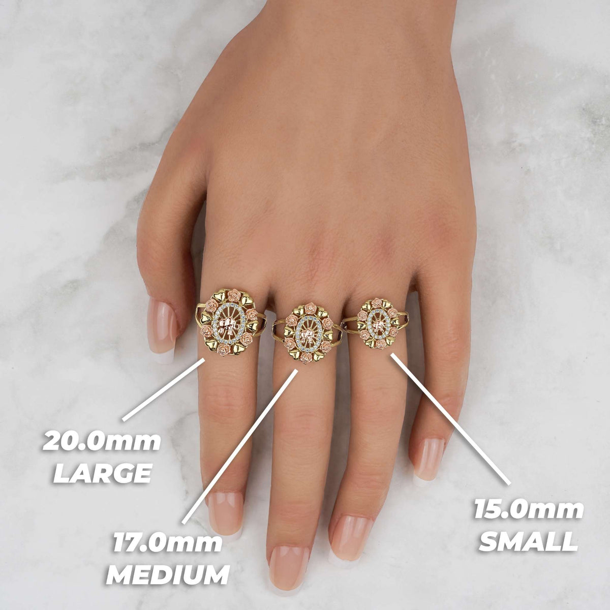 Hand wearing 20.0mm large, 17.0mm medium, and 15.0mm small tricolor gold oval rings.