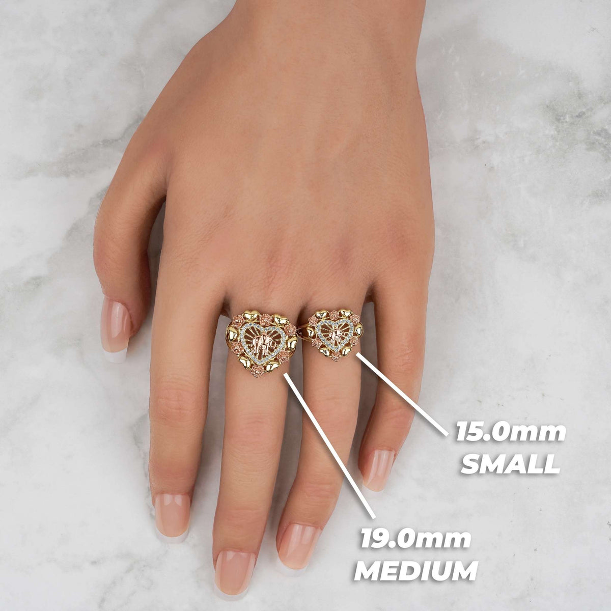 Hand wearing 19.0mm medium and 15.0mm small tricolor gold elephant heart rings.