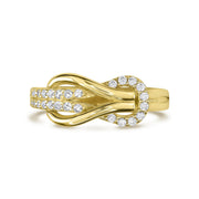 Gold infinity buckle loop ring with clear cubic zirconia stone accents.
