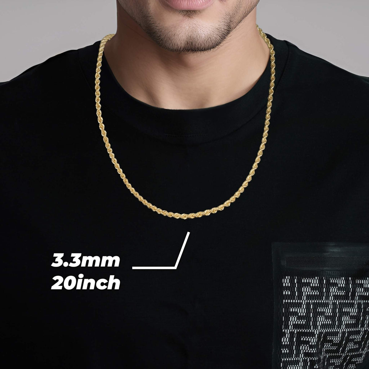 Model wearing a 3.3mm, 20-inch 14k gold rope chain over a black shirt.