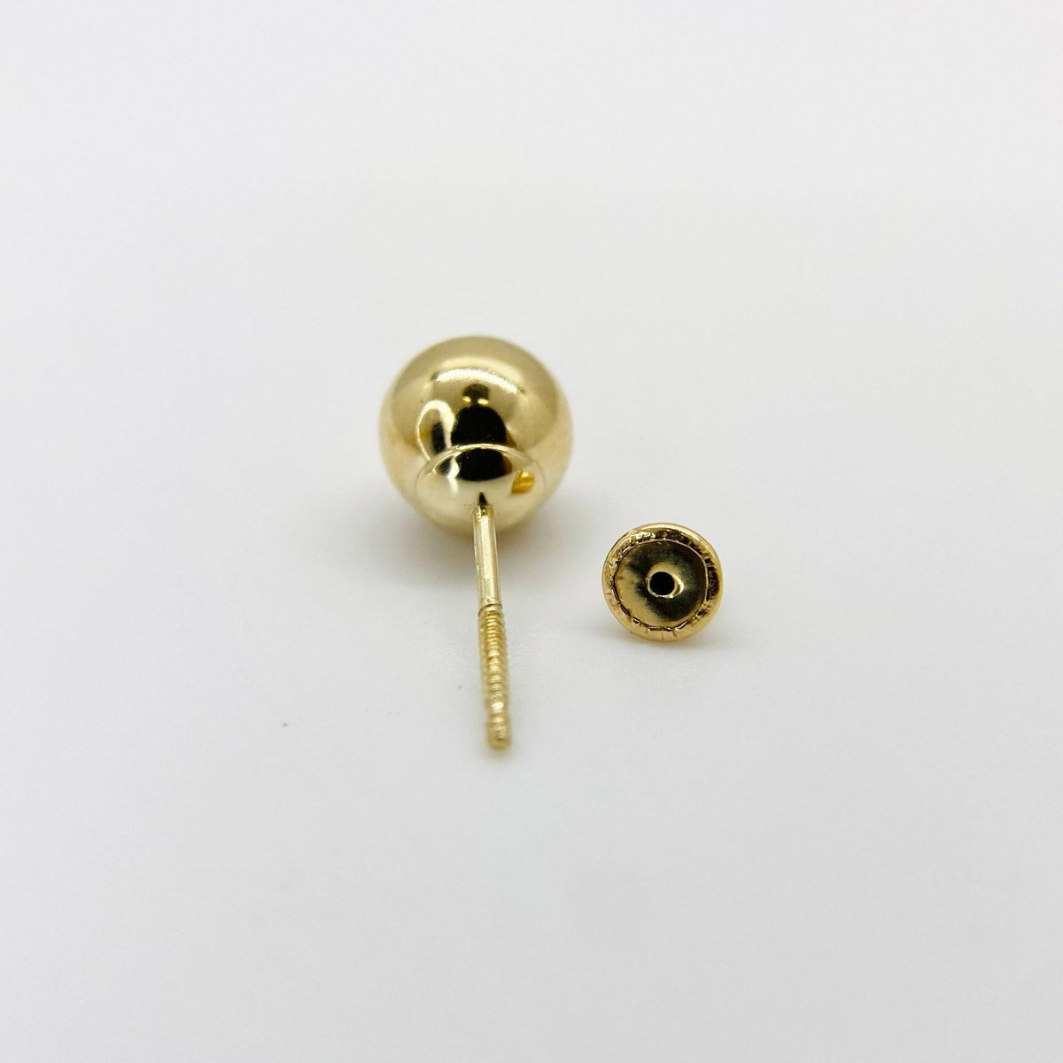 Pair of 14k yellow gold classic round ball stud earrings with secure screw backs.