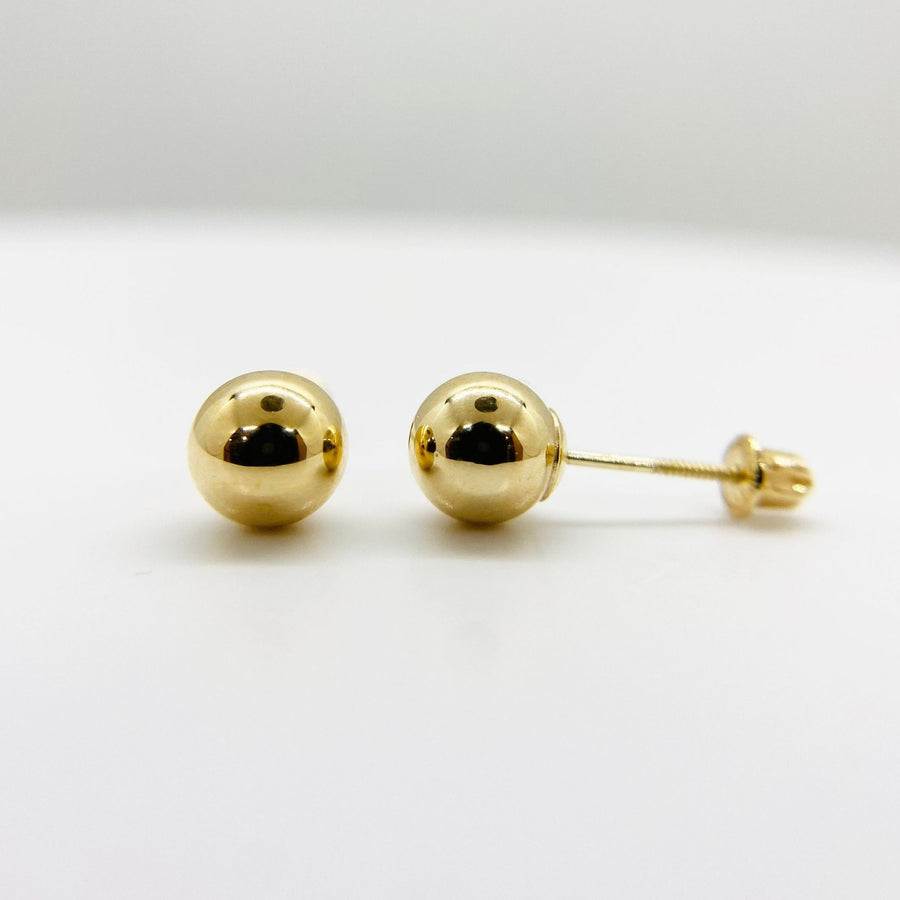 Pair of 14k yellow gold classic round ball stud earrings with secure screw backs.