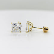 Pair of square cubic zirconia stud earrings set in polished 14k yellow gold.