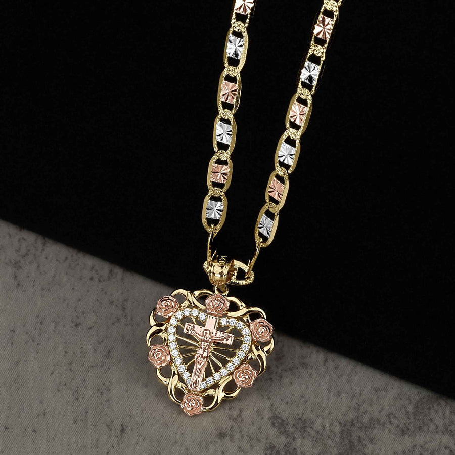 Two-tone 14k gold crucifix bloom rose heart pendant necklace on a tricolor chain.