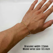 14k Gold Cuban Bracelet on a wrist with text indicating width and model wrist size.