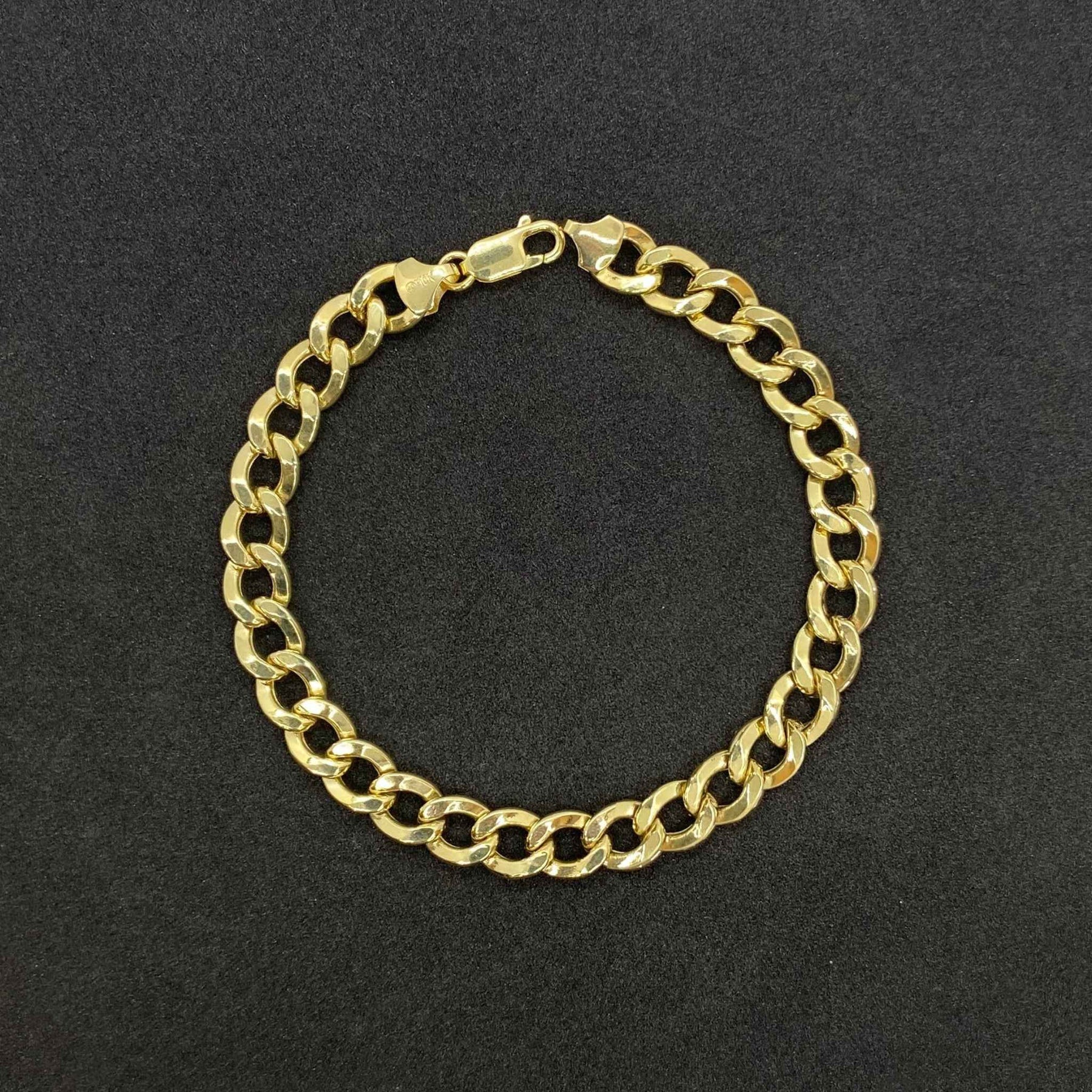 14k Gold Cuban Curb Link Bracelet Anklet on a black backgound