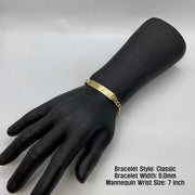 Black mannequin wrist display wearing a 6.0mm 14k gold Classic style ID bracelet.