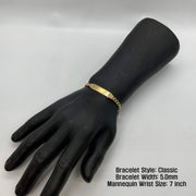 Black mannequin wrist display wearing a 5.0mm 14k gold Classic style ID bracelet.