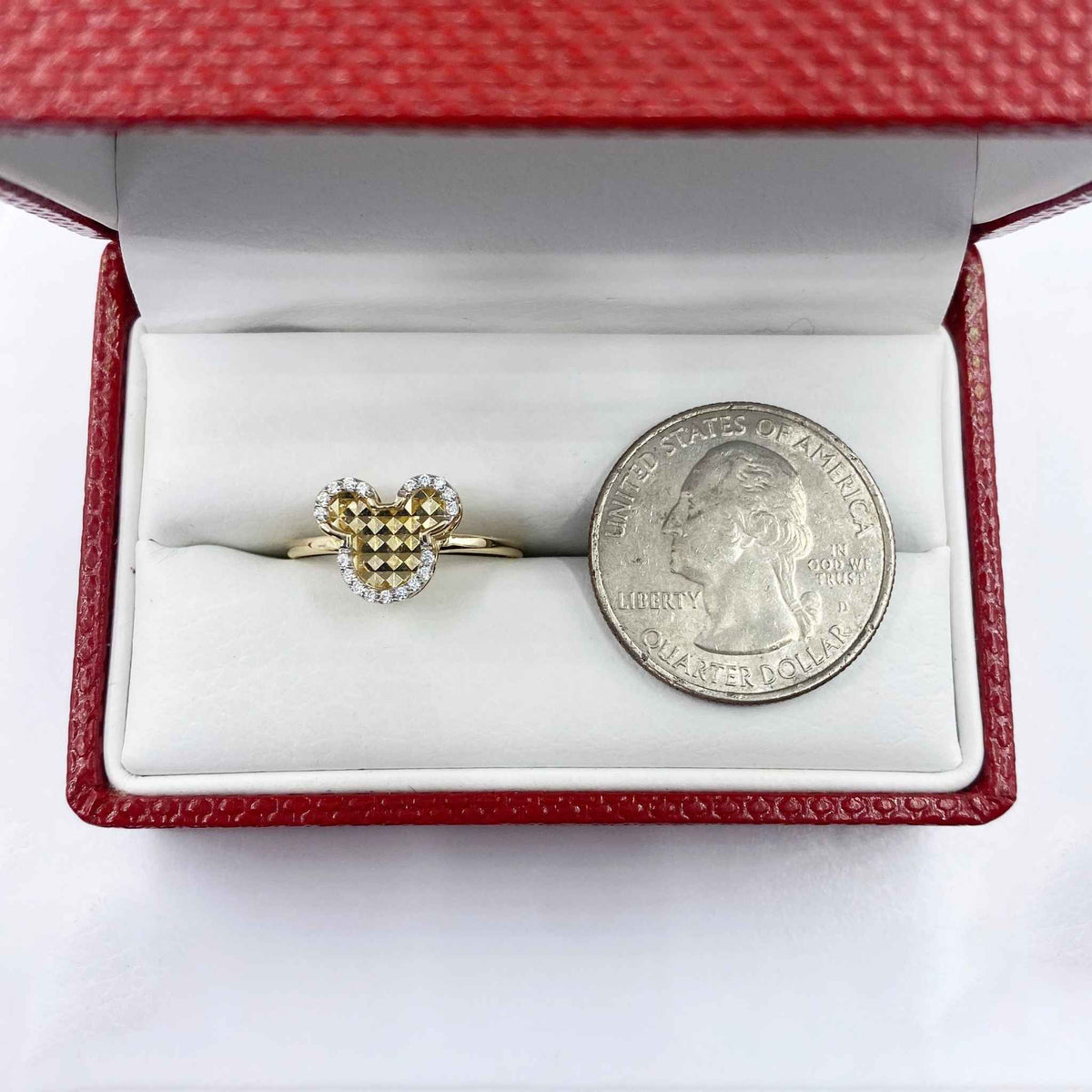 14k Gold Dainty Mouse Ring in a red box with a quarter for scale.