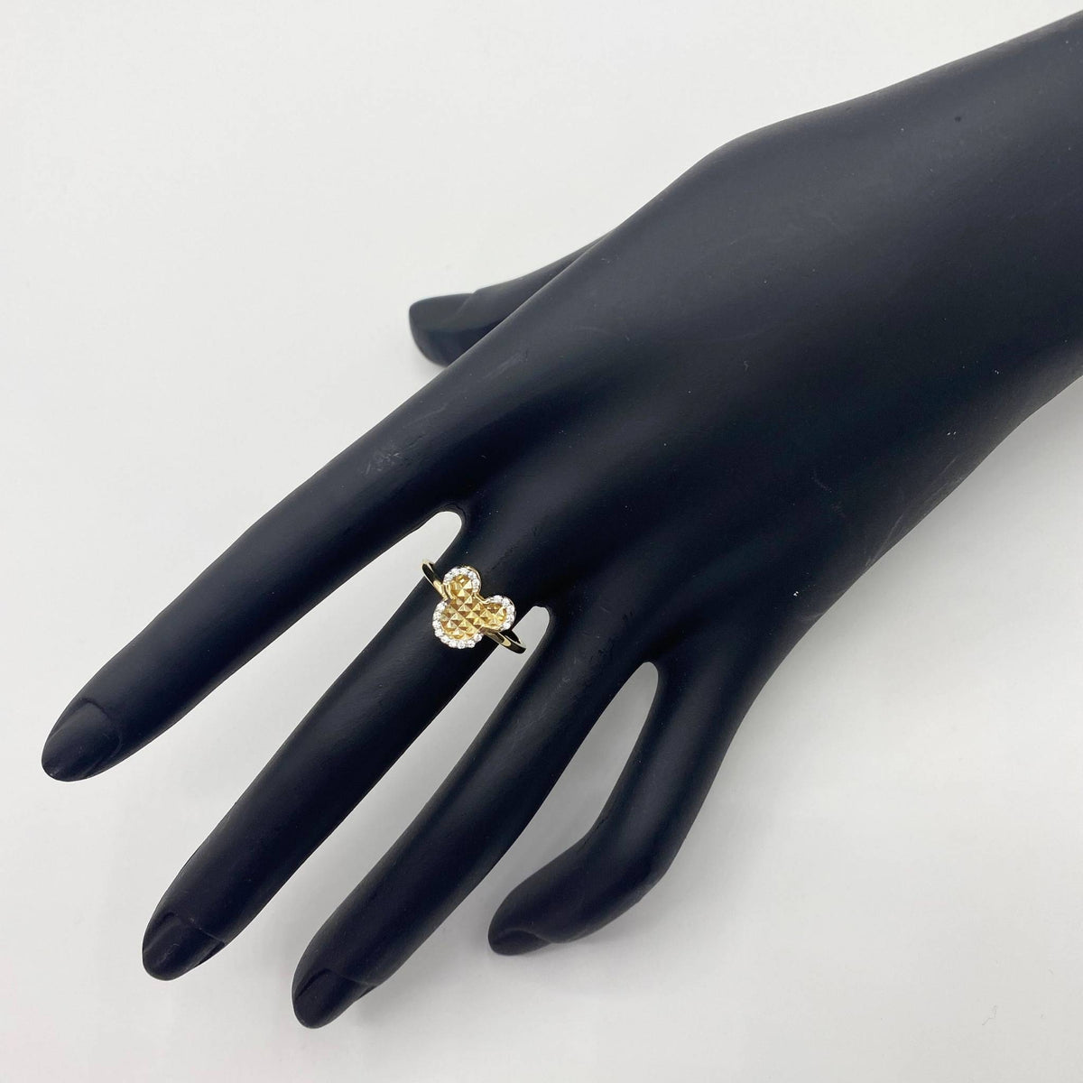14k Gold ring with a Dainty Mouse design on a black mannequin hand against a white background